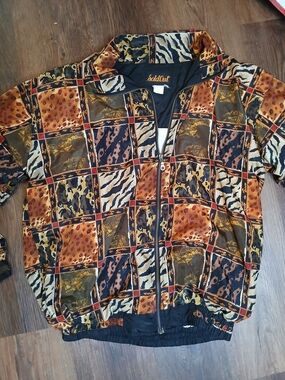vintage SoldOut brand windbreaker jacket featuring a patchwork animal print